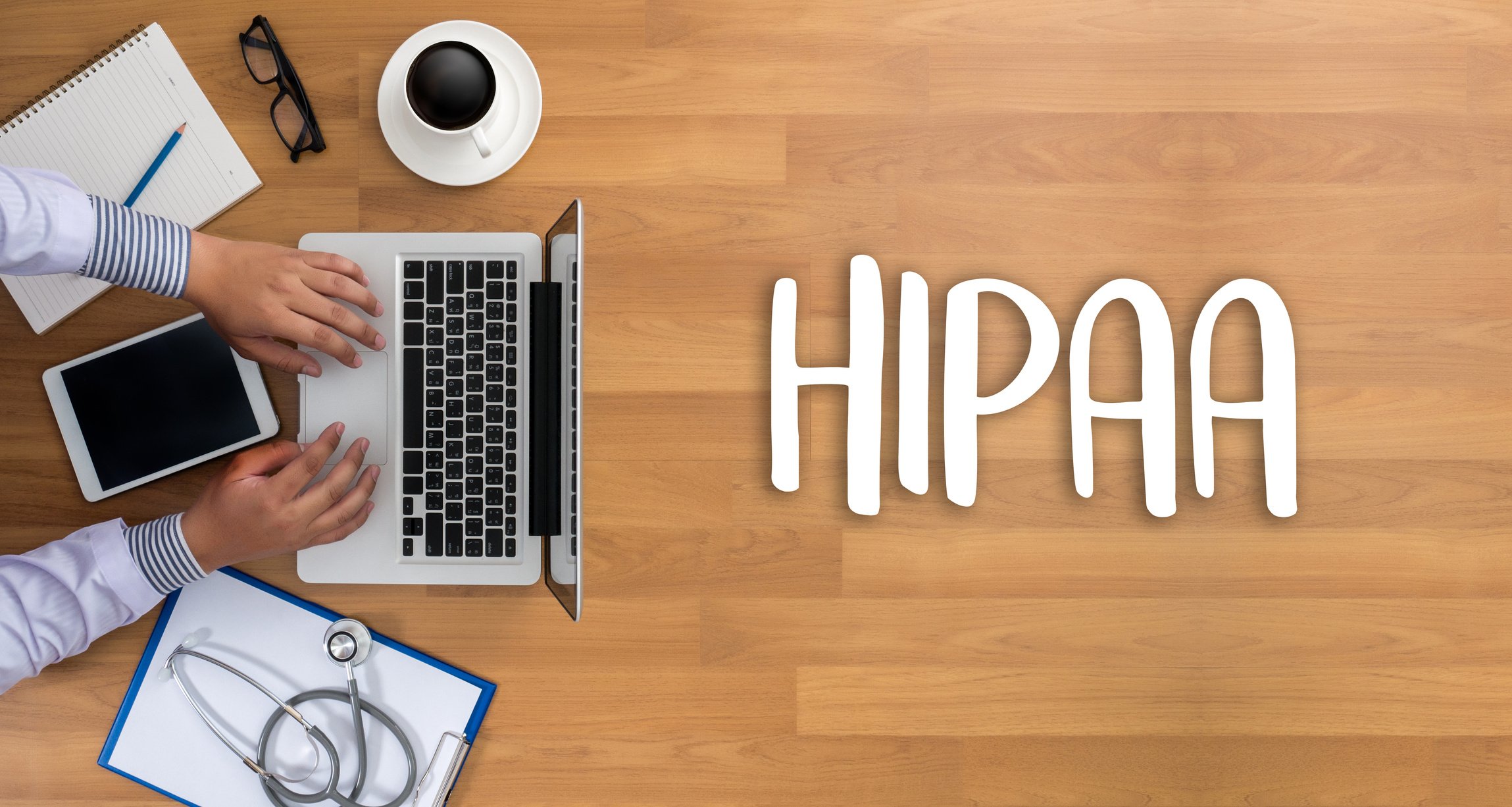 HIPAA Professional doctor use computer and medical equipment all around, desktop top view